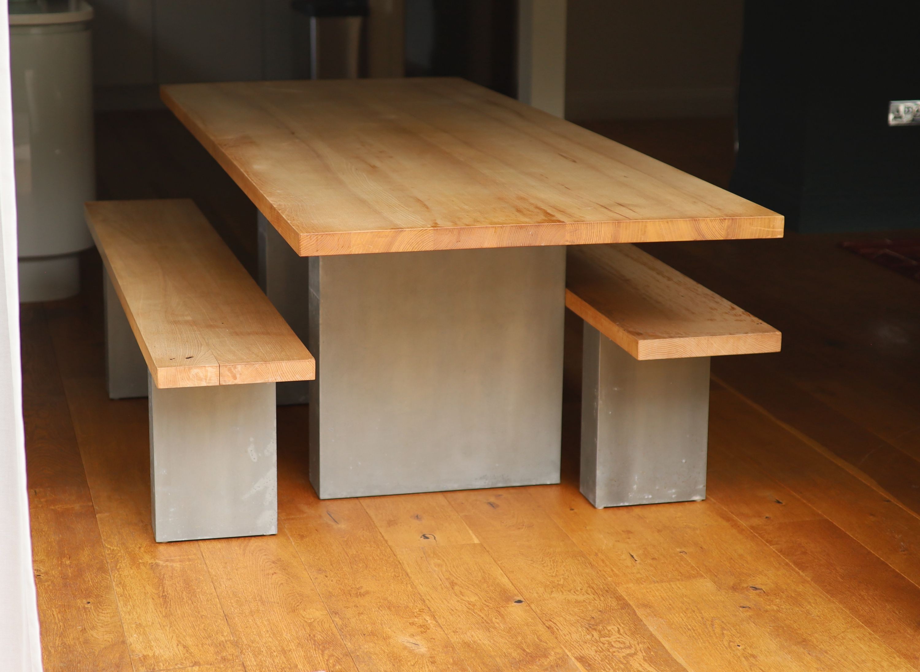 A contemporary oak kitchen table with pair of matching benches and oxidised metal supports, table width 230cm depth 90cm height 74cm, benches width 180cm